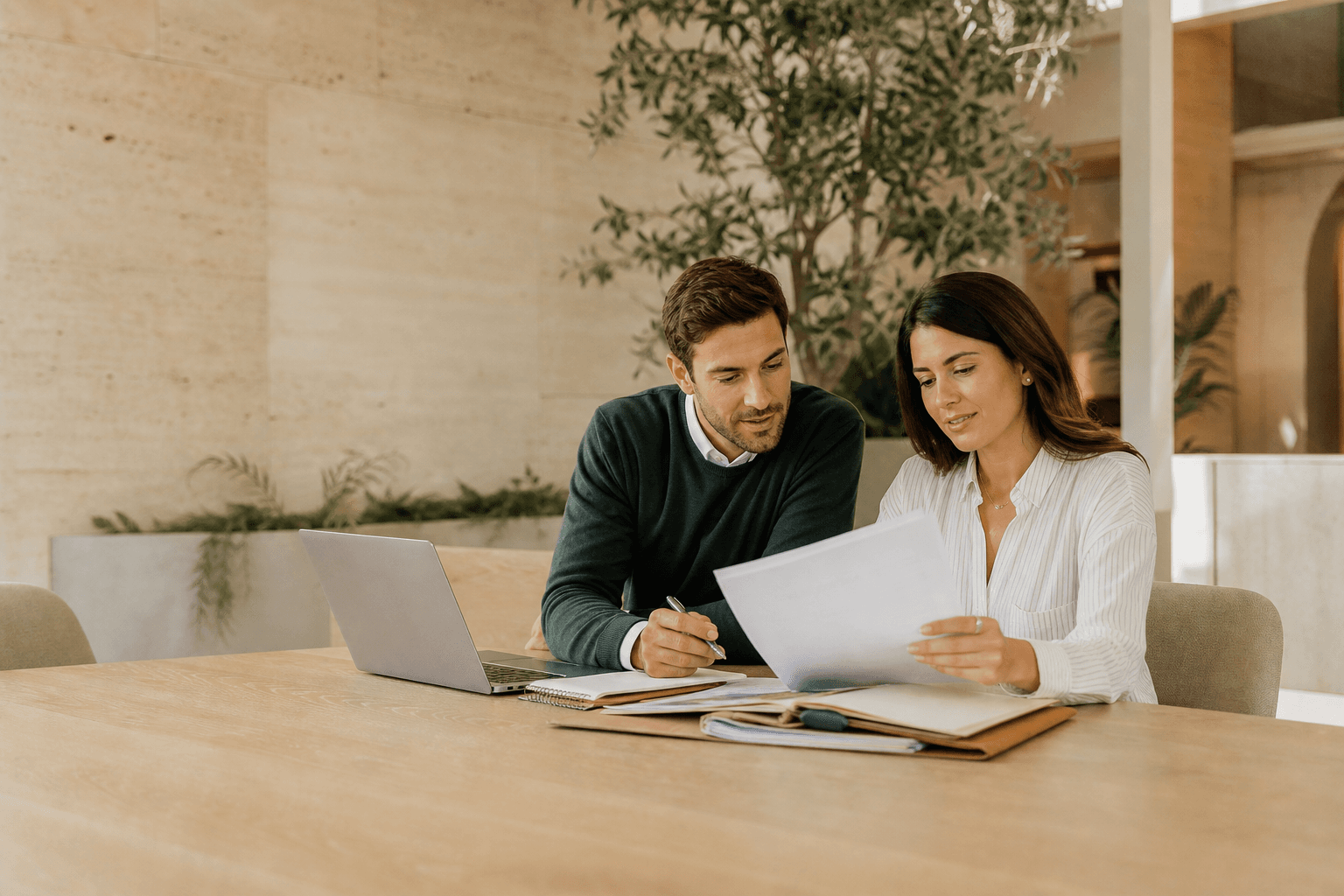 Two colleagues reviewing payables and receivables together
