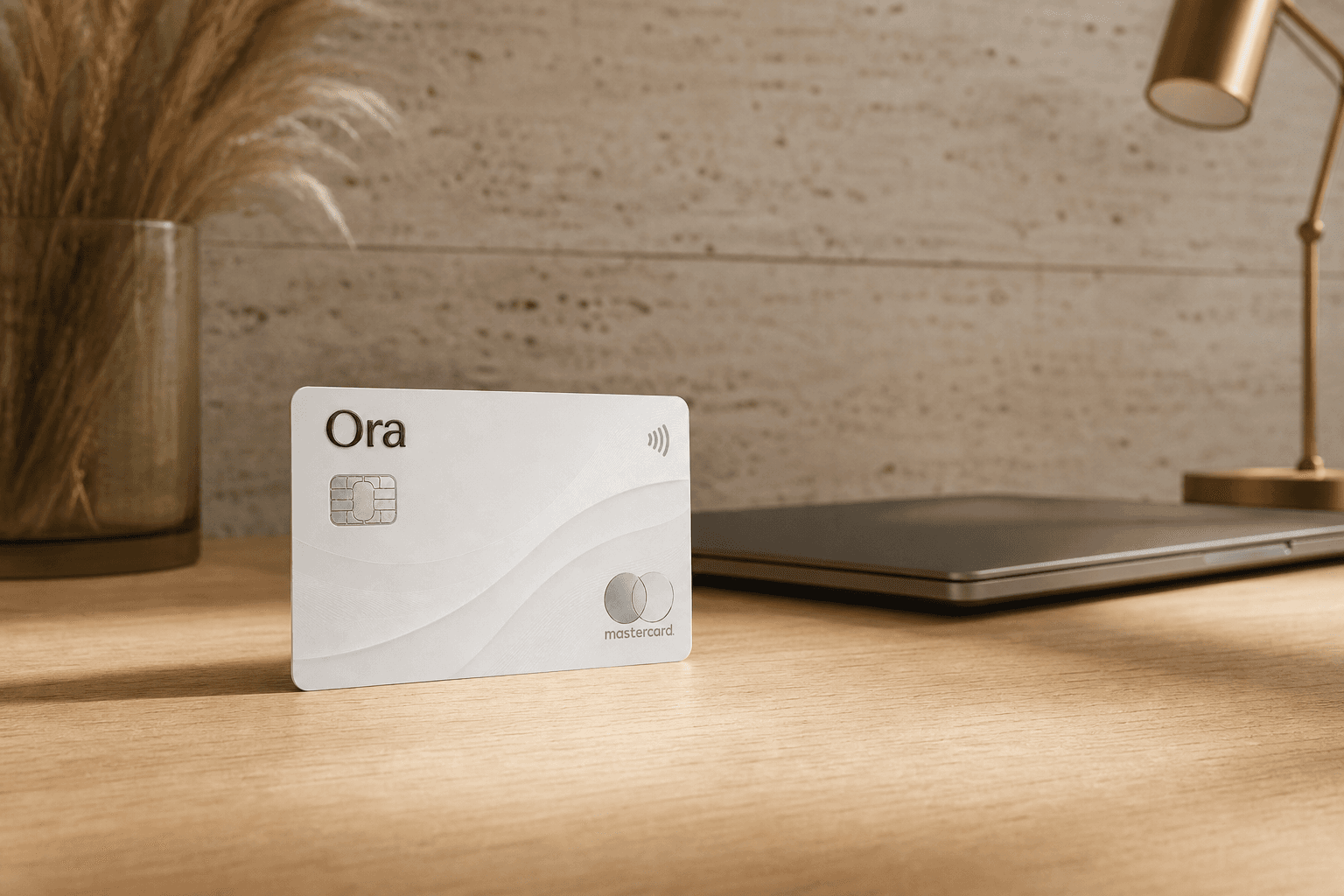 An Ora card standing on a sunlit oak desk in a calm home office